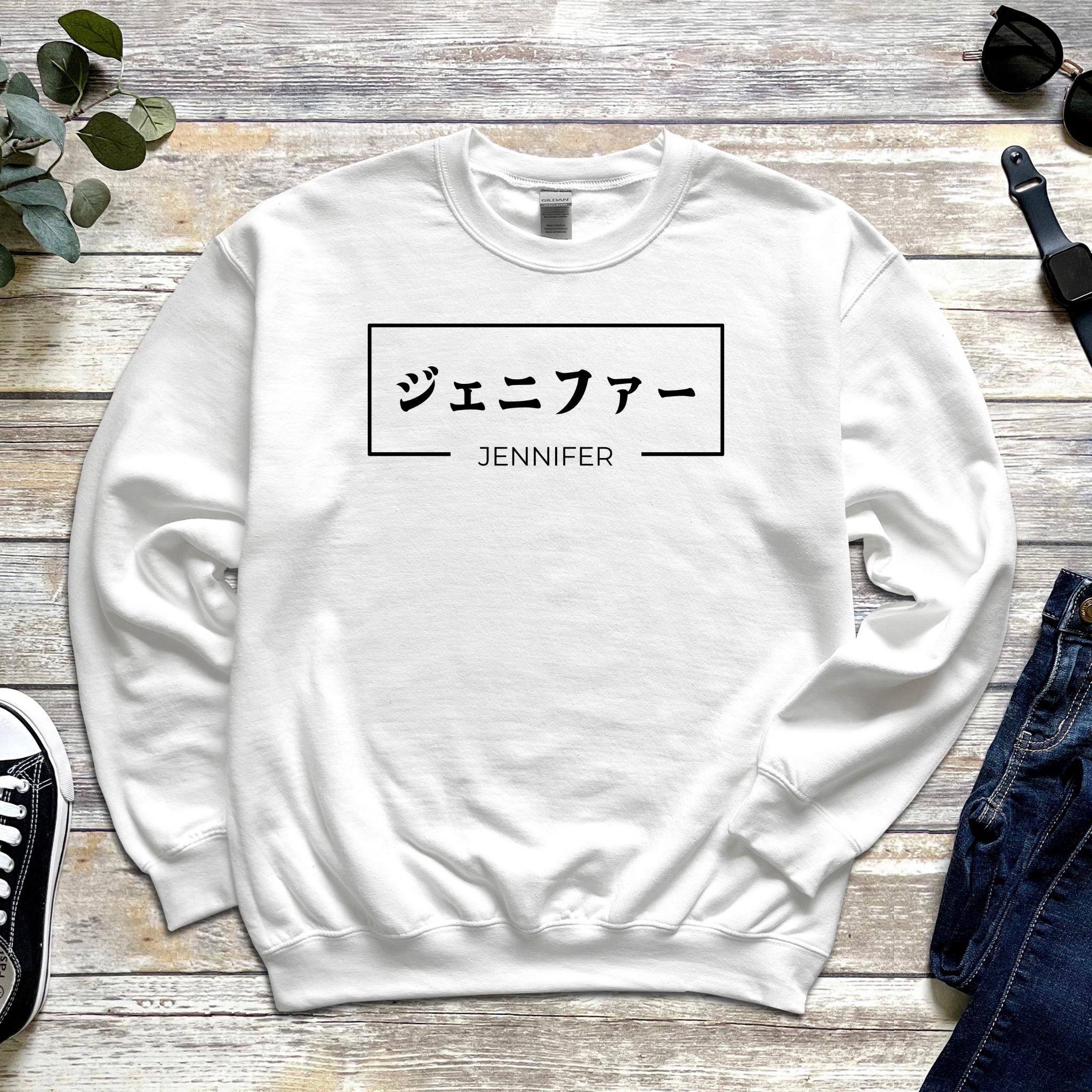 a white sweatshirt with japanese characters on it