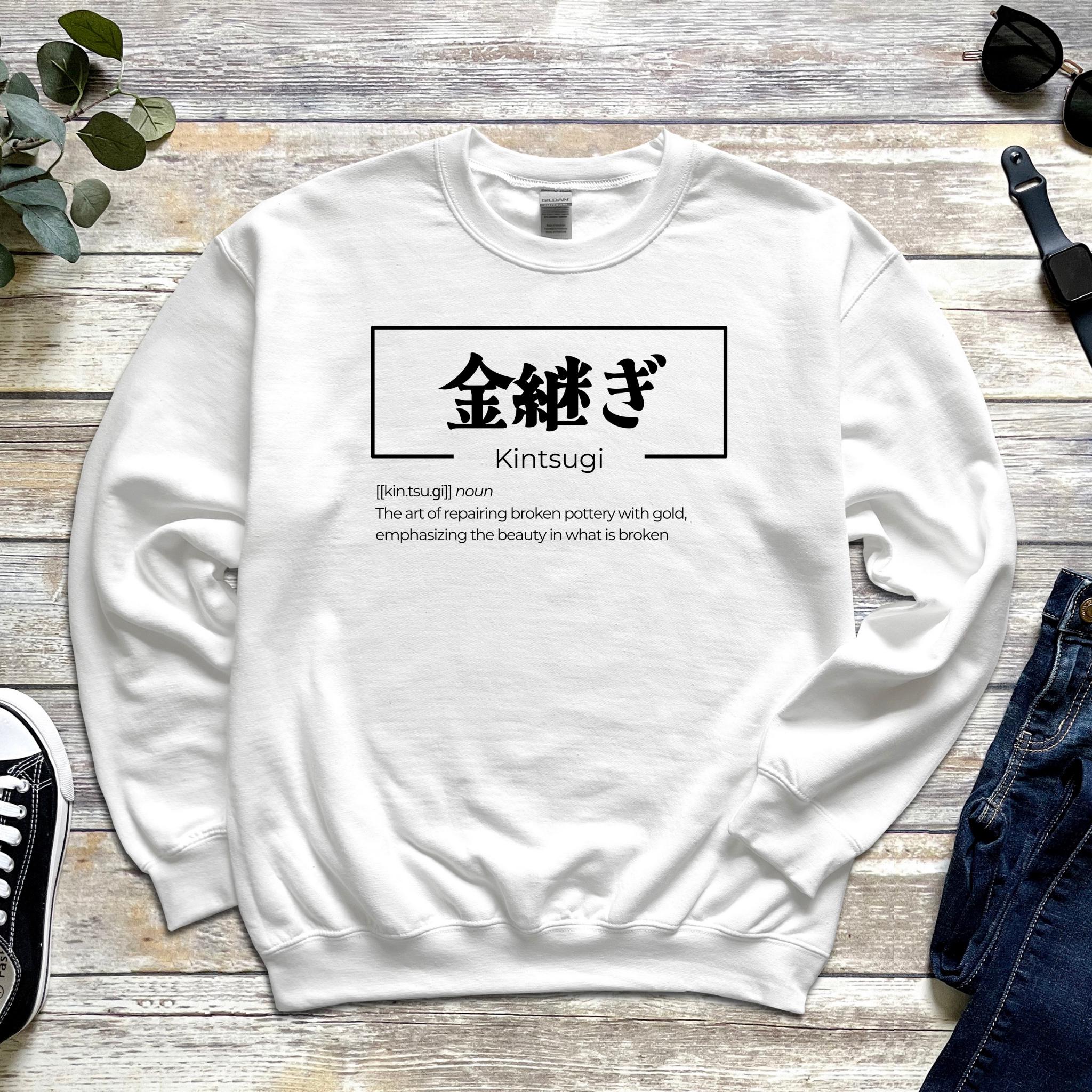 a white sweatshirt with an asian writing on it