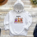 a white hoodie with a cartoon character on it