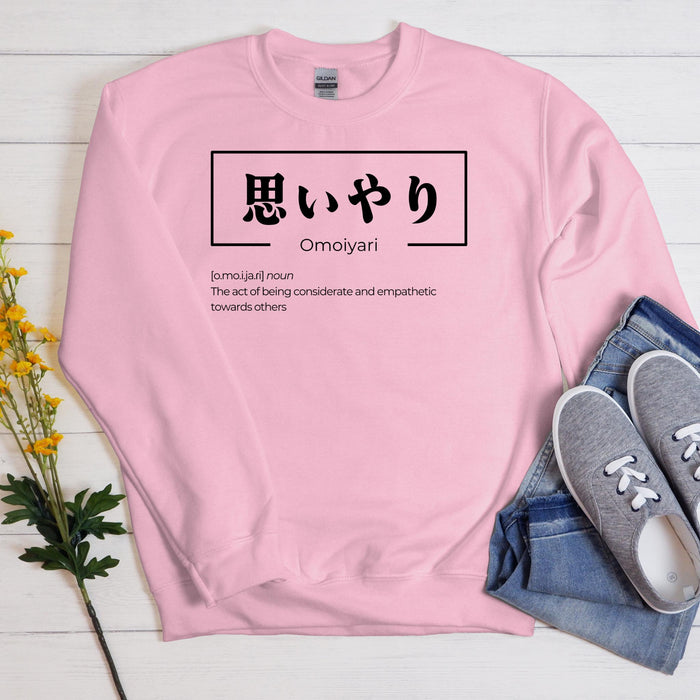 a pink sweatshirt with japanese characters on it