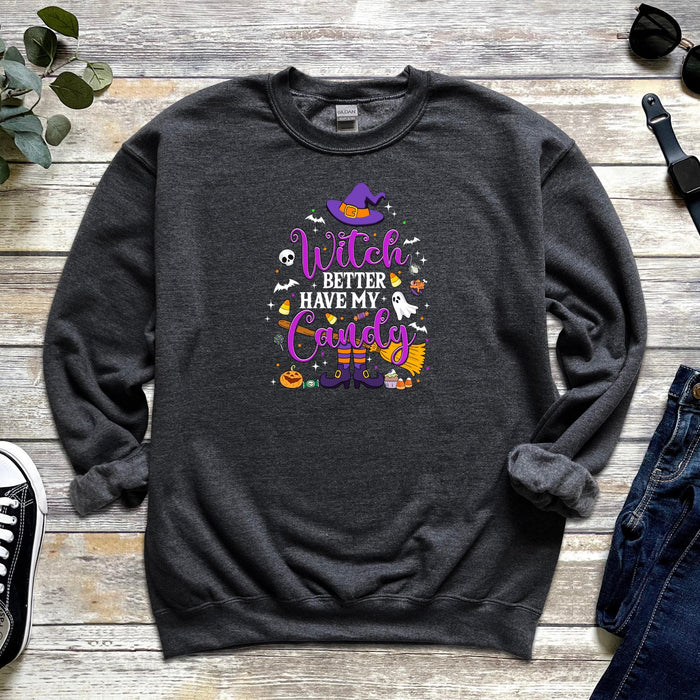 a sweatshirt with witch saying on it next to a pair of jeans