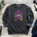 a sweatshirt with witch saying on it next to a pair of jeans
