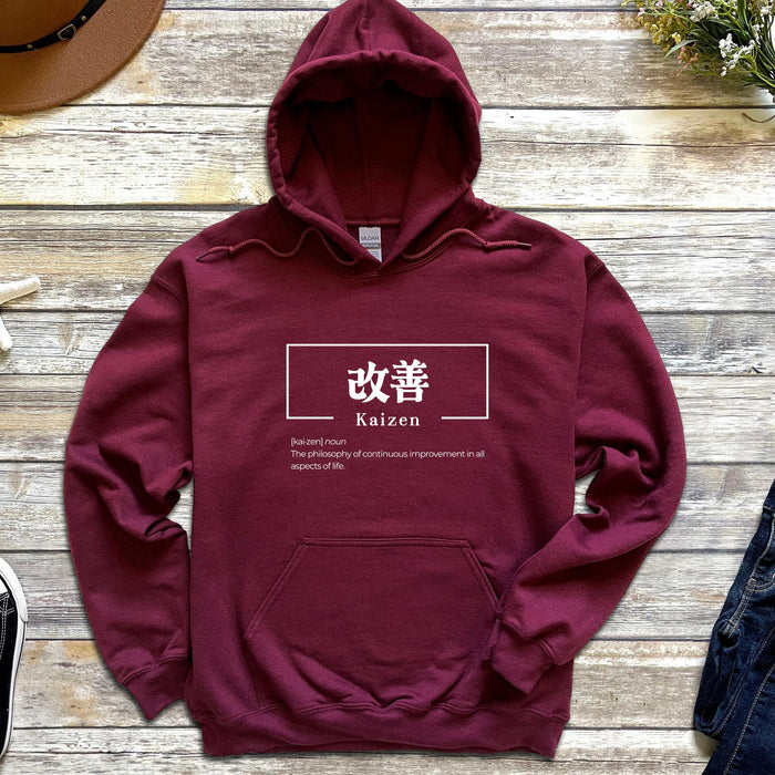 a maroon hoodie with a japanese symbol on it