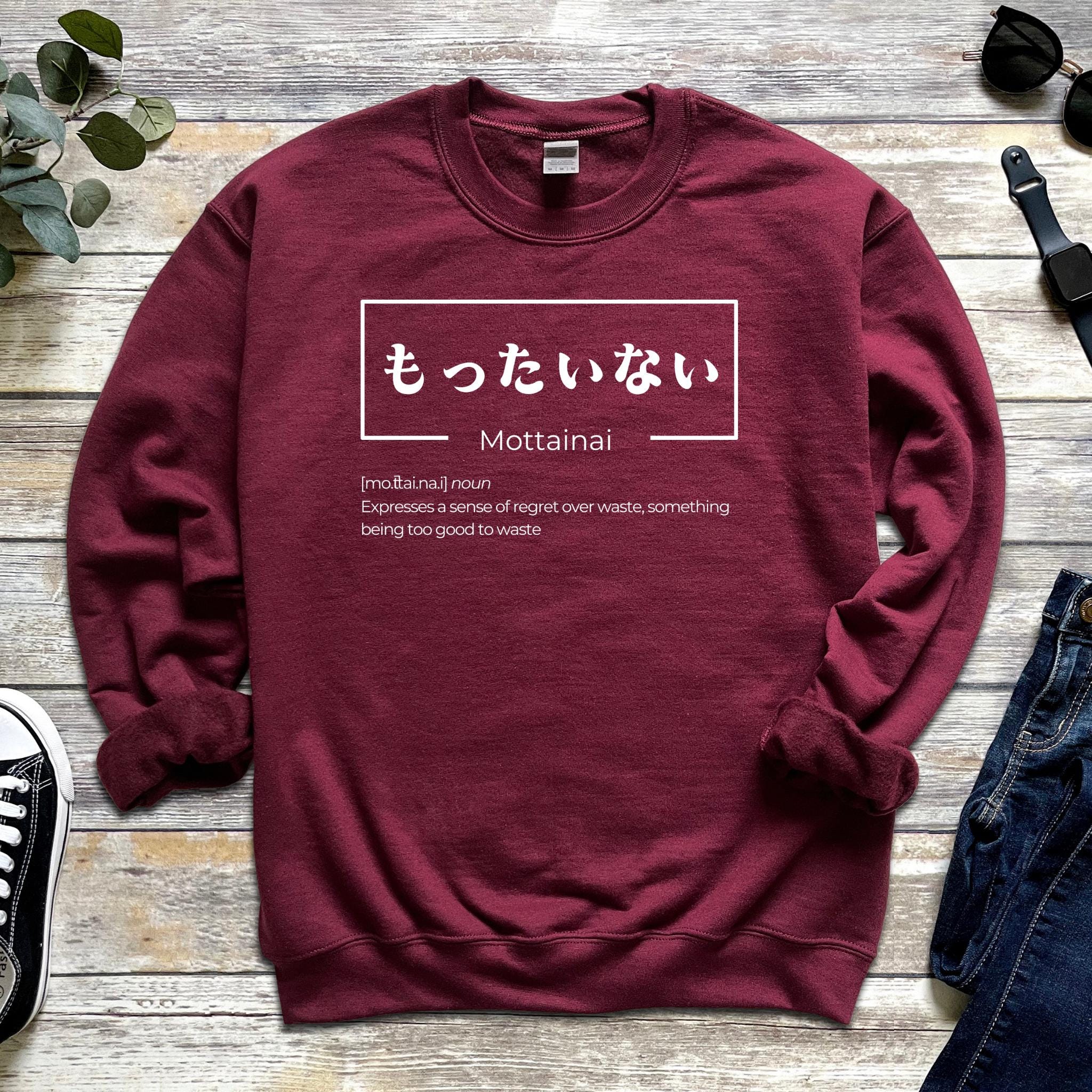 a red sweatshirt with japanese writing on it
