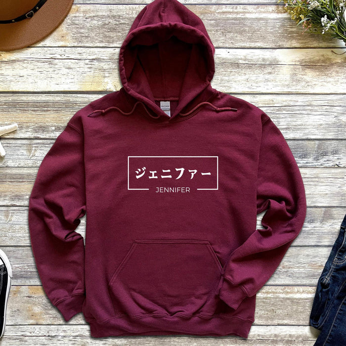 a maroon hoodie with japanese writing on it