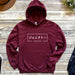 a maroon hoodie with japanese writing on it