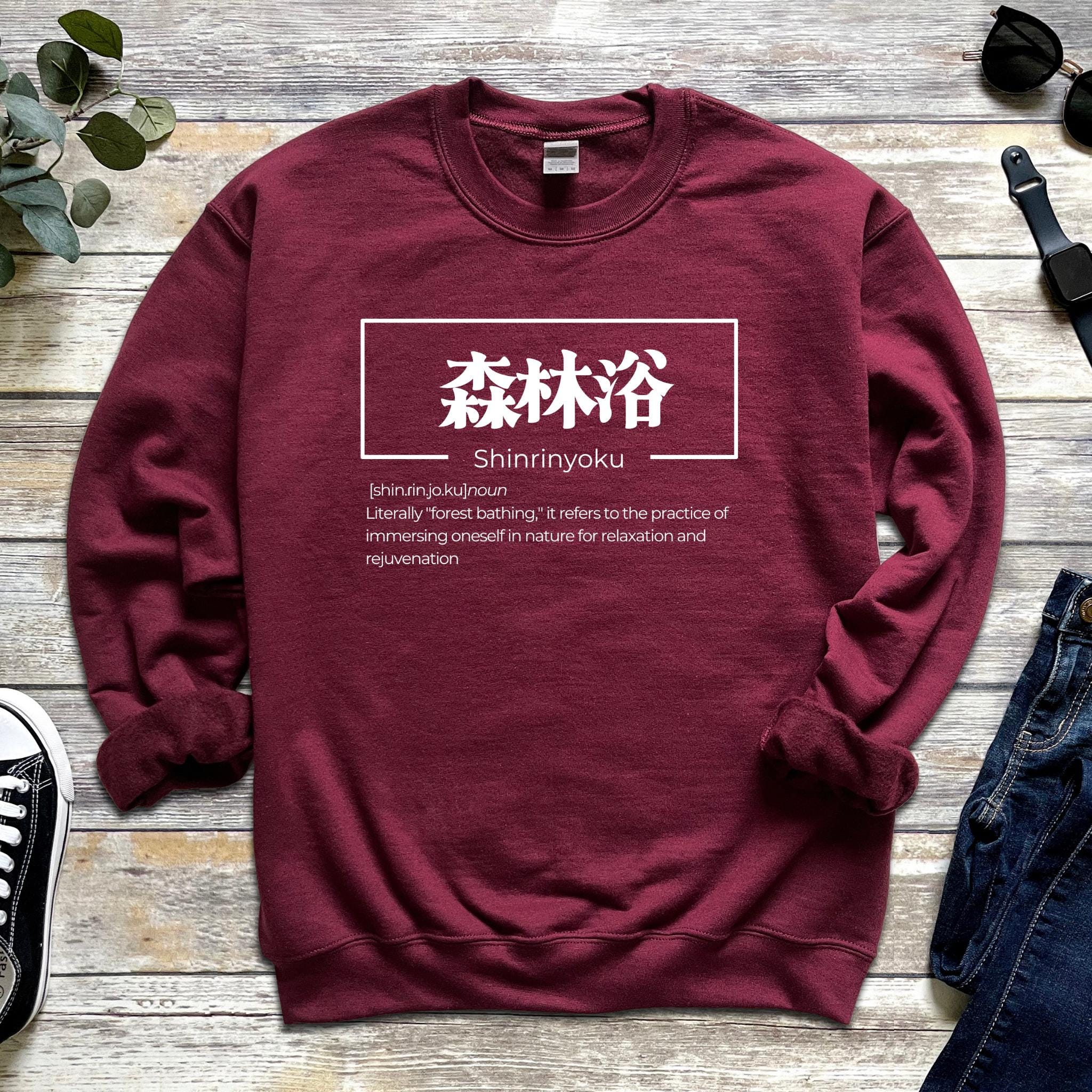 a red sweatshirt with chinese characters on it