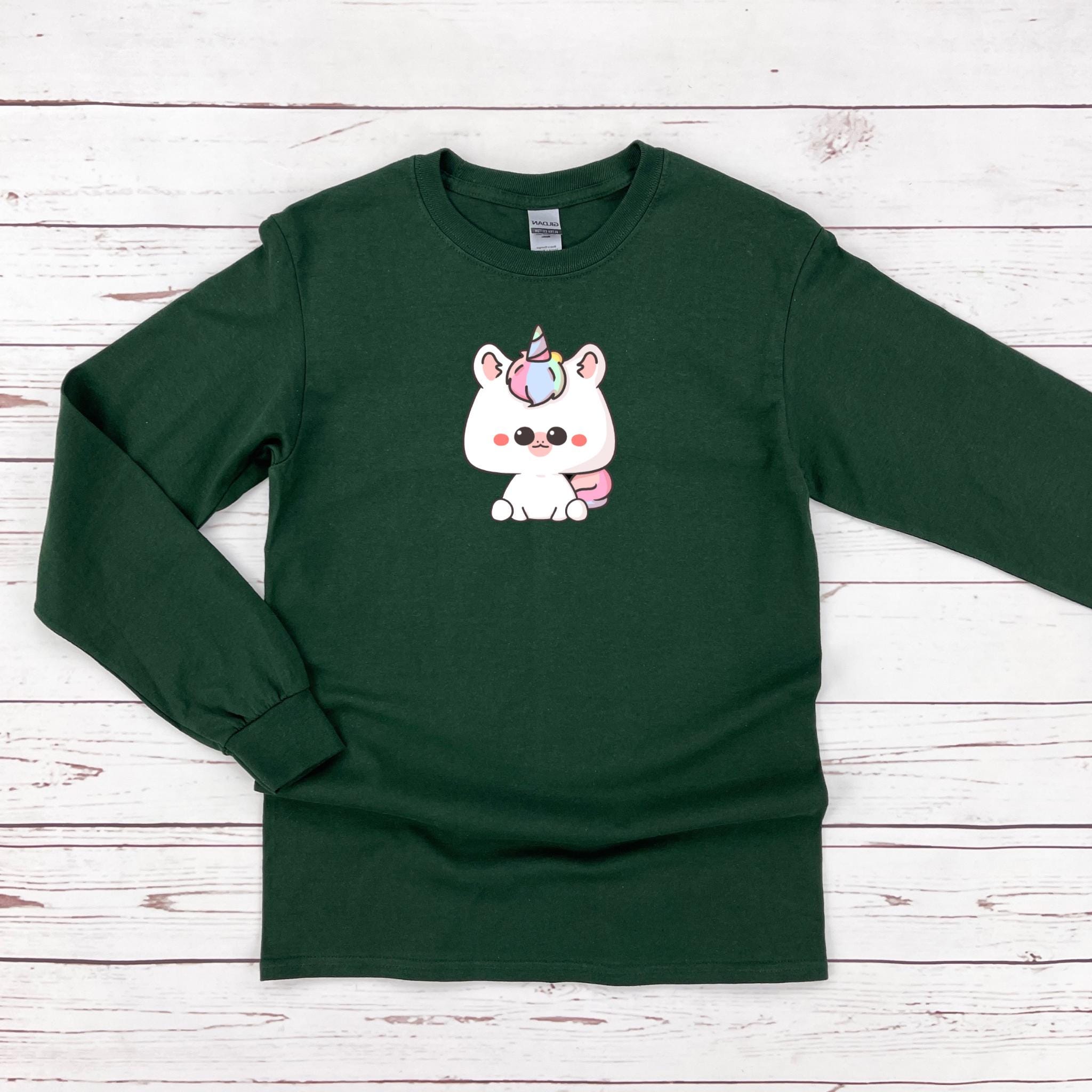 a green sweatshirt with a unicorn on it