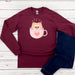 a red shirt with a cat in a cup on it