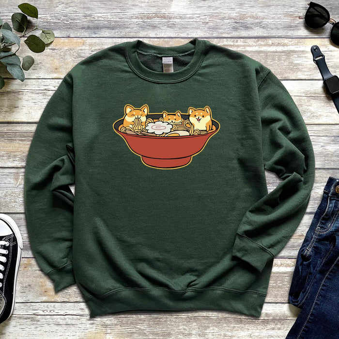 a green sweatshirt with three cats in a bowl on it
