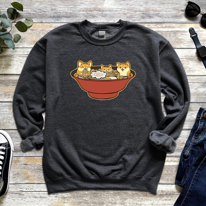 a sweatshirt with two cats in a bowl on it