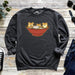 a sweatshirt with two cats in a bowl on it