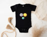 a baby bodysuit with a picture of the earth and sun on it