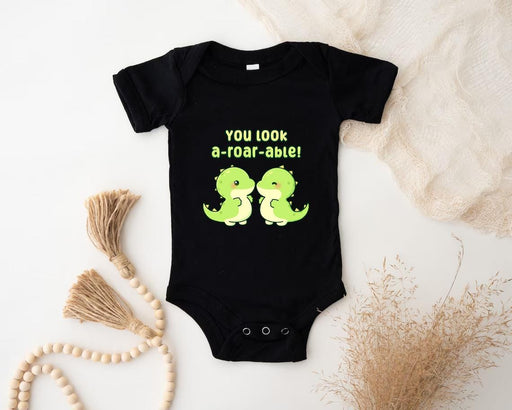 a baby bodysuit that says you look a - tor - abael on it