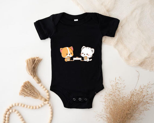 a baby bodysuit with two dogs on it