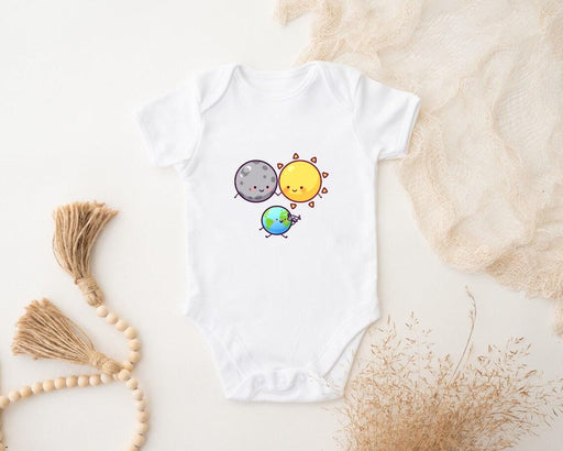 a baby bodysuit with a picture of the sun and the moon on it