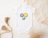 a baby bodysuit with a picture of the sun and the moon on it