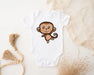 a baby bodysuit with a cartoon monkey on it