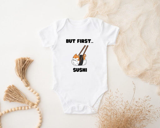 a baby bodysuit that says, but first sushi