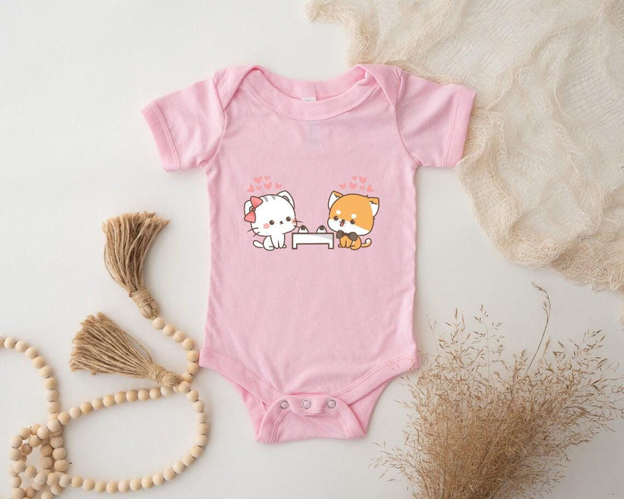 a baby bodysuit with a picture of a cat and a dog on it
