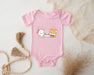 a baby bodysuit with a picture of a cat and a dog on it