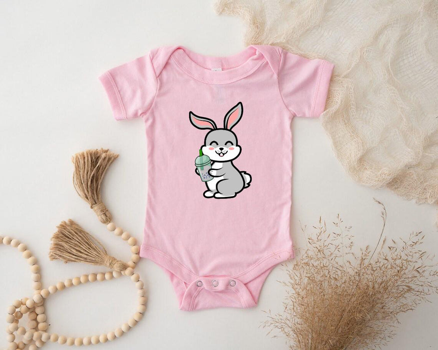 a baby bodysuit with a cartoon bunny holding a carrot
