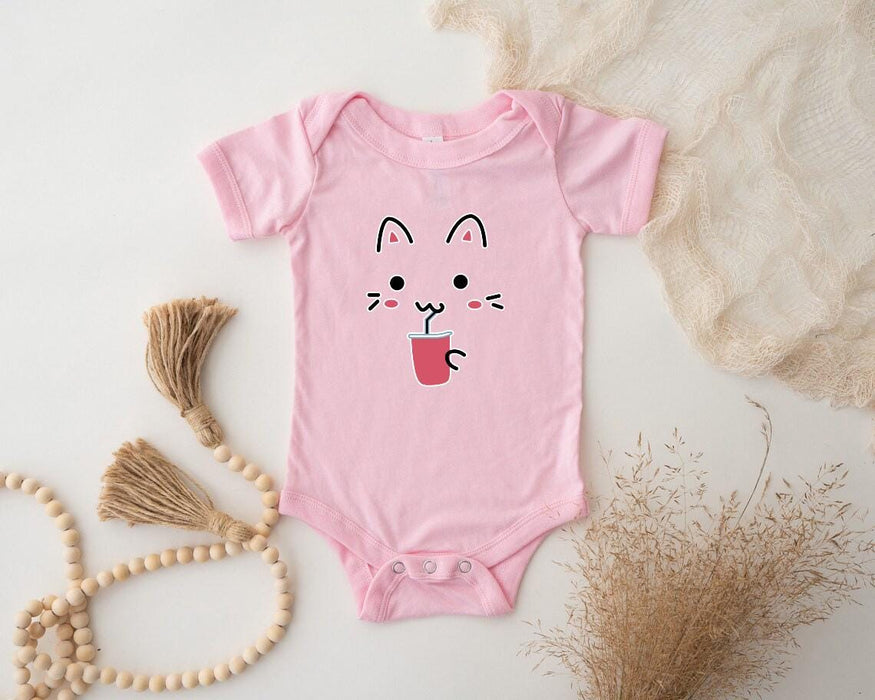 a pink bodysuit with a cat face on it