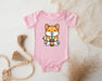 a baby bodysuit with a picture of a fox holding a drink