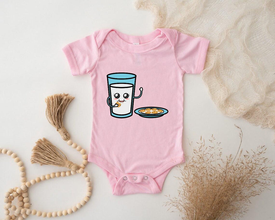 a baby bodysuit with a picture of a glass of milk and a plate of
