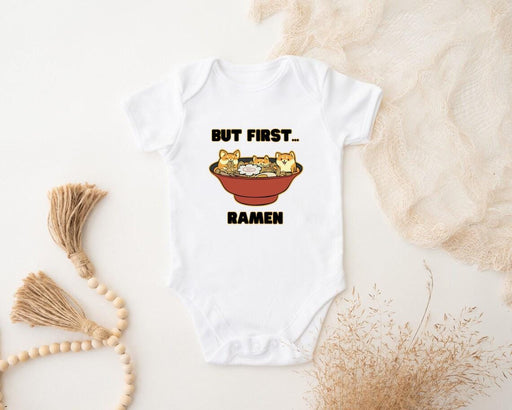 a baby bodysuit that says, but first, ramen