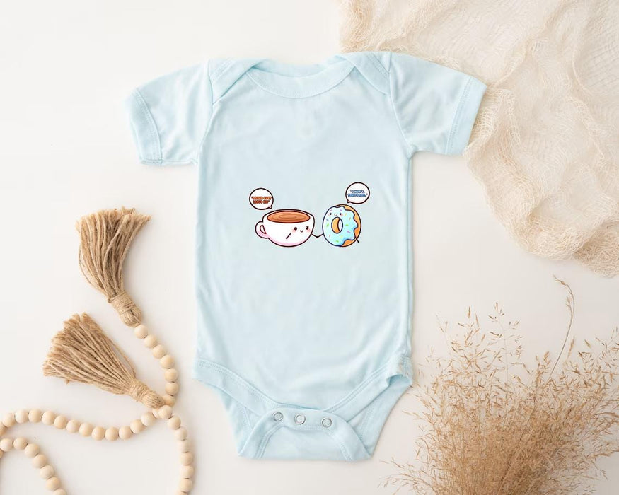 a baby bodysuit with a picture of a cup of coffee and a donut