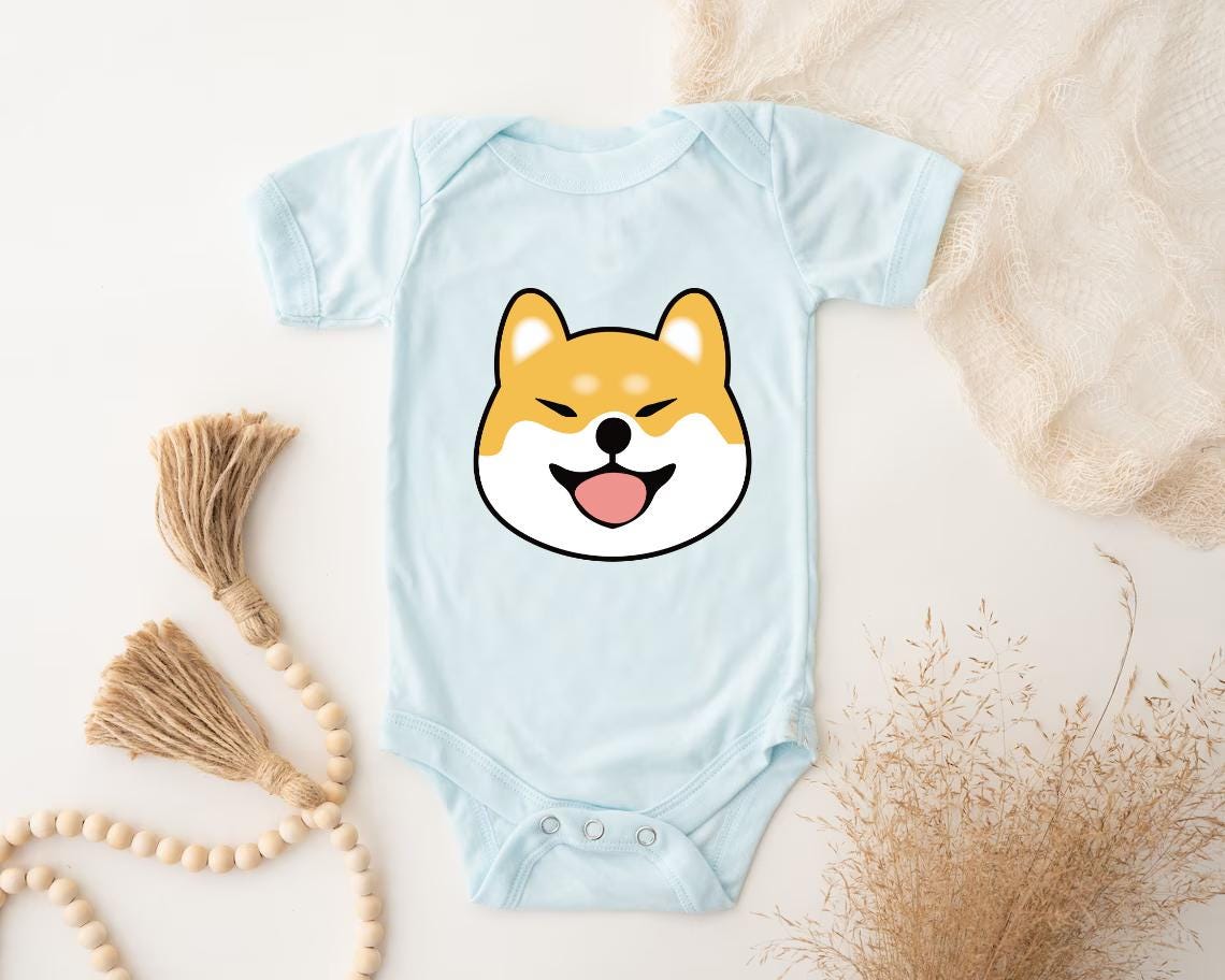 a baby bodysuit with a dog's face on it