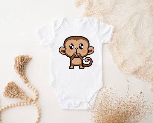 a baby bodysuit with a cartoon monkey on it