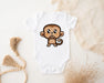 a baby bodysuit with a cartoon monkey on it