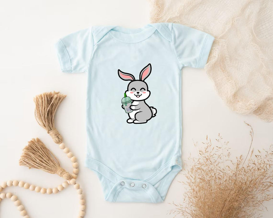 a baby bodysuit with a bunny holding a carrot
