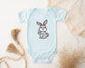 a baby bodysuit with a bunny holding a carrot