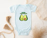 a baby bodysuit with two avocados on it