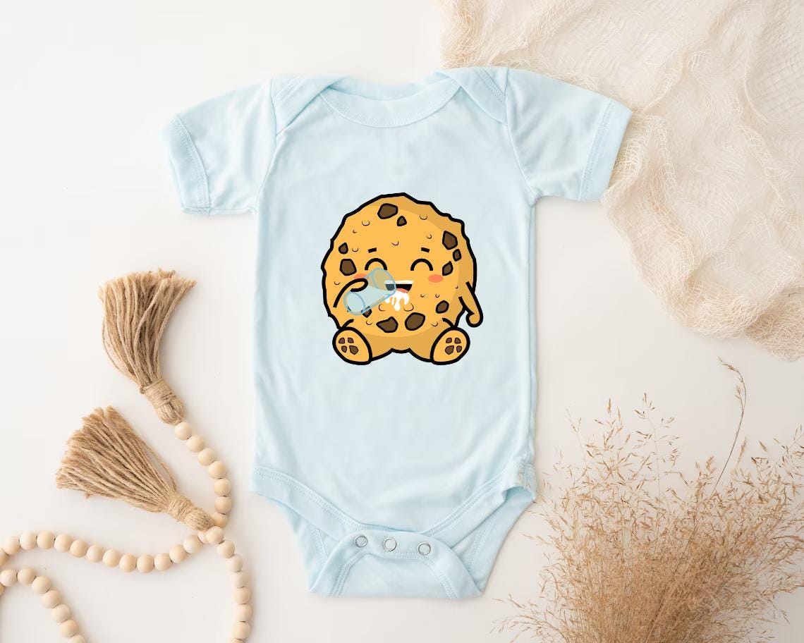 a baby bodysuit with a cookie on it