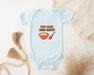 a baby bodysuit with a bowl of cereal on it