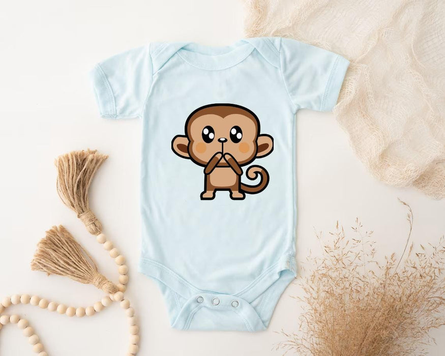 a baby bodysuit with a cartoon monkey on it