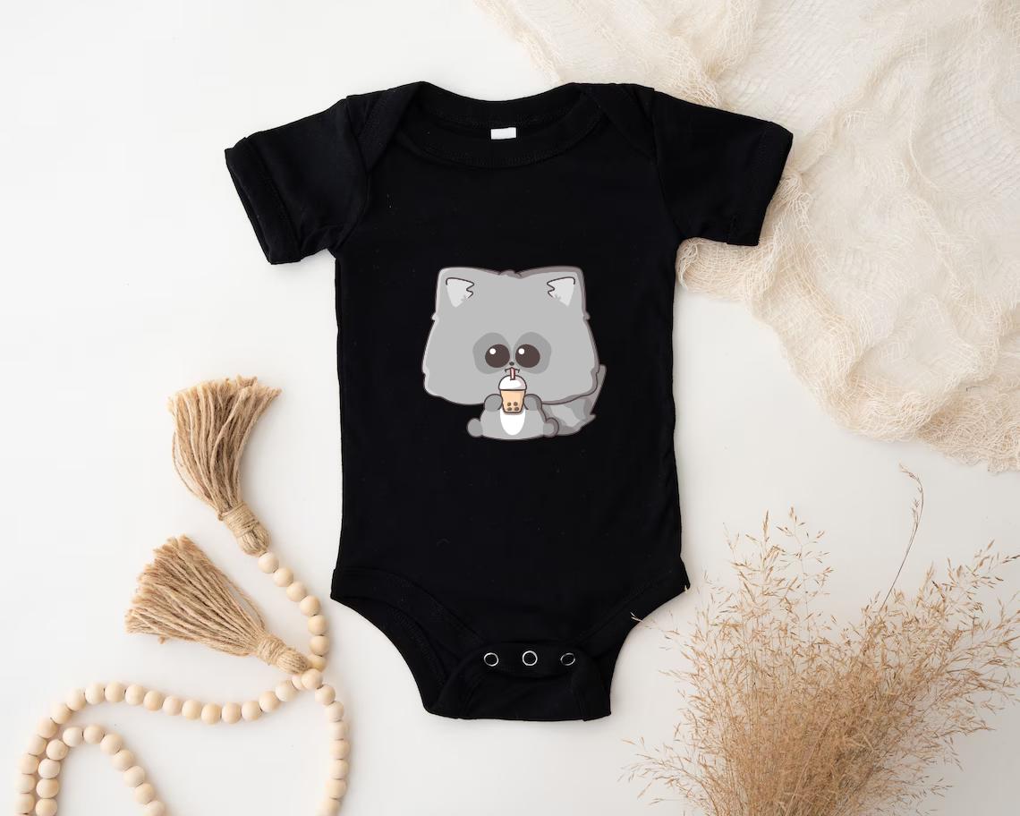 a baby bodysuit with a koala holding a cup of coffee
