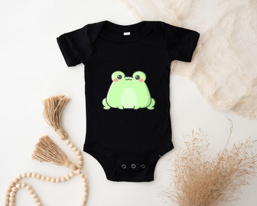 a black bodysuit with a green frog on it