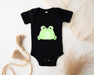 a black bodysuit with a green frog on it