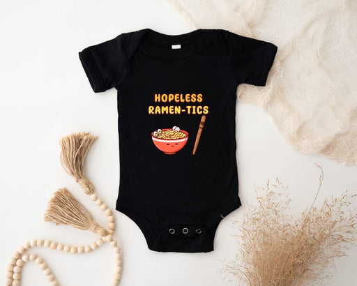 a baby bodysuit with a picture of a bowl of ramen
