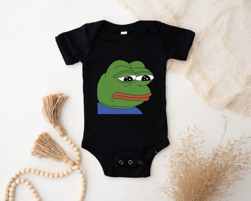a bodysuit with a picture of a frog on it