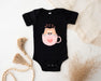 a baby bodysuit with a cat in a cup on it