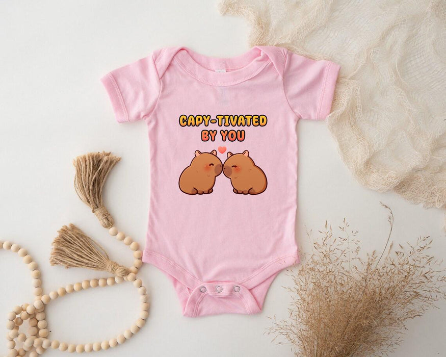 a pink baby bodysuit with two brown bears on it