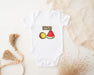 a baby bodysuit with a watermelon and a slice of watermelon