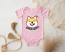 a pink baby bodysuit with a cartoon dog on it