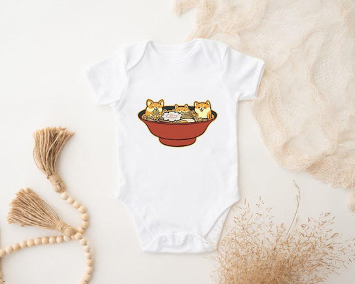 a baby bodysuit with a picture of two cats in a bowl